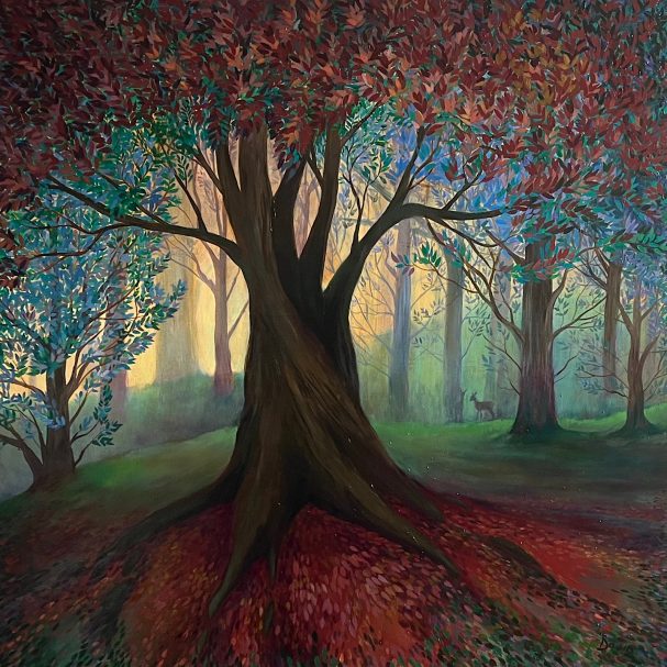 A vibrant forest scene with a large tree and autumn foliage.