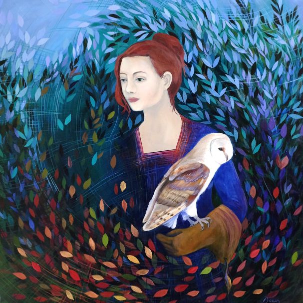 A woman in blue holds a barn owl, surrounded by vibrant foliage and colourful leaves.